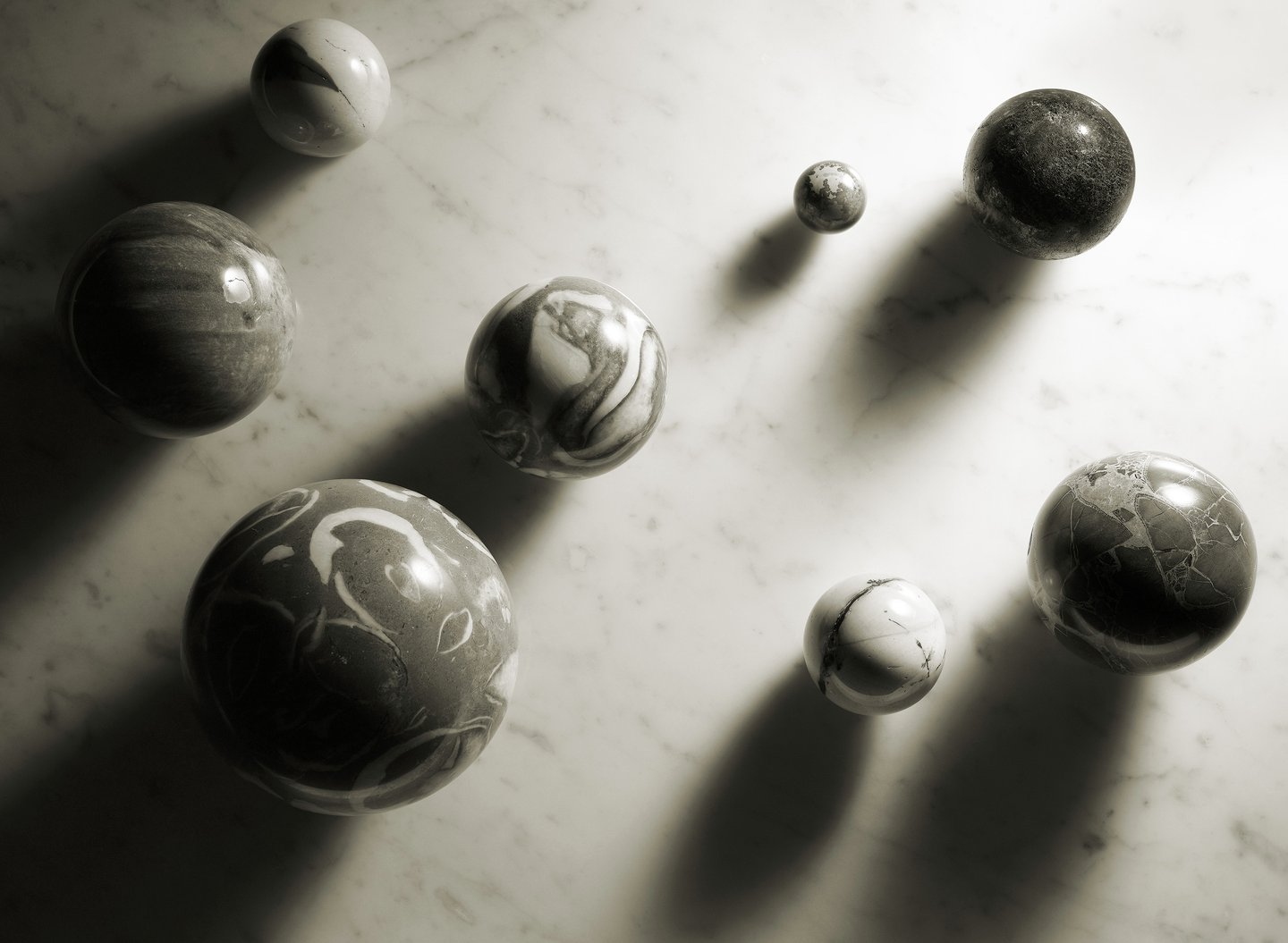 black and white image of marble spheres on a marble background