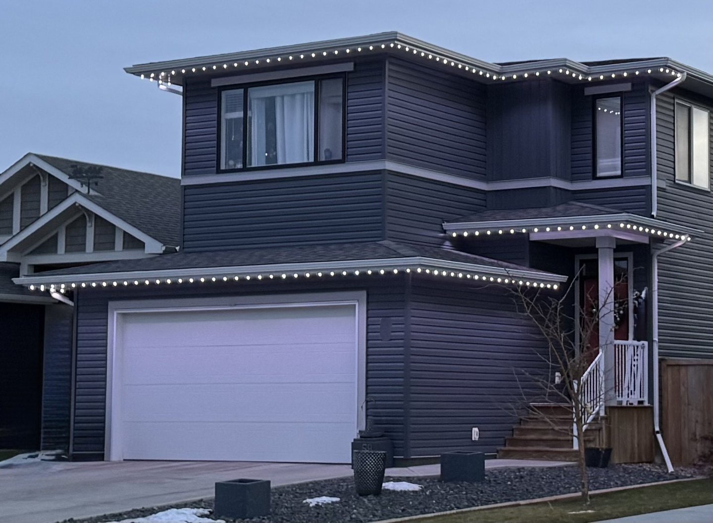 Beautiful permanent holiday lighting installed by MY-LITES certified dealers on a home exterior. 