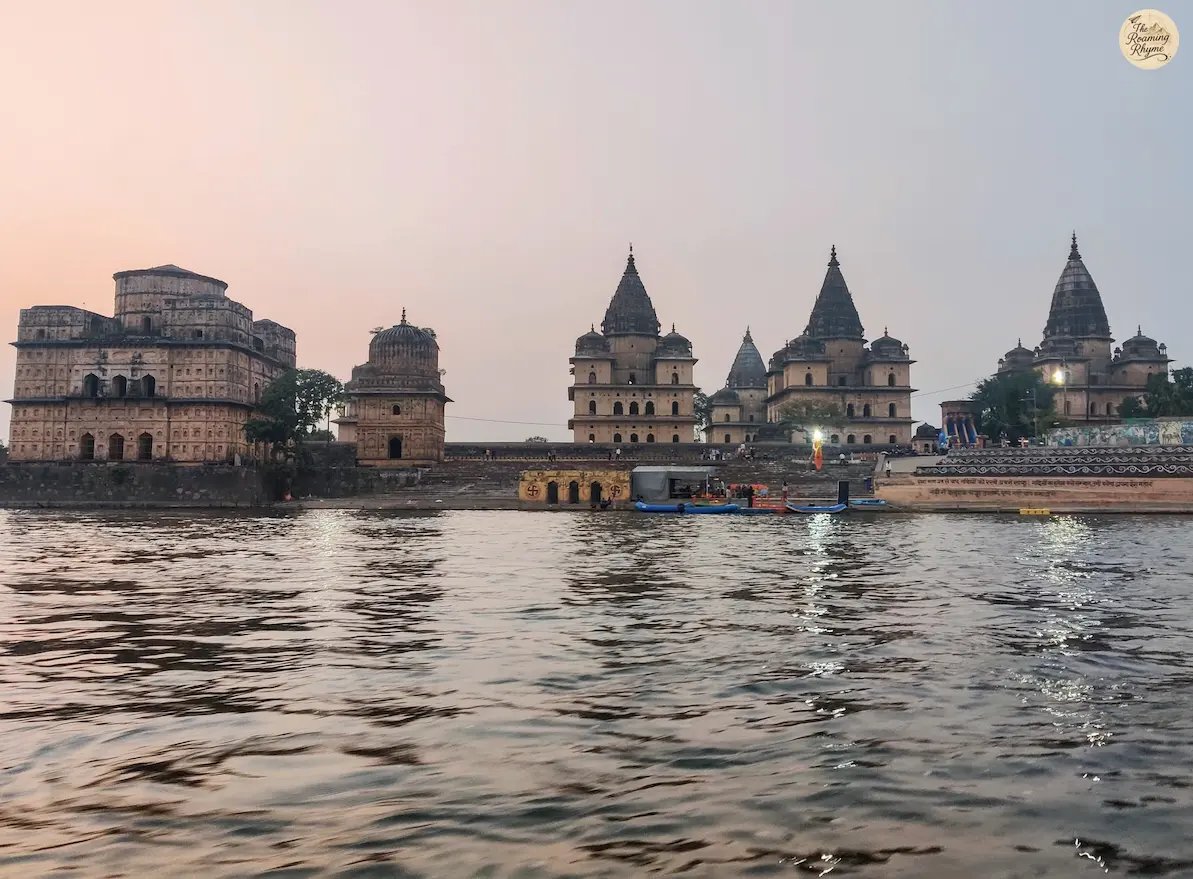 Scenic view of Orchha's royal cenotaphs from a boat on the Betwa River.