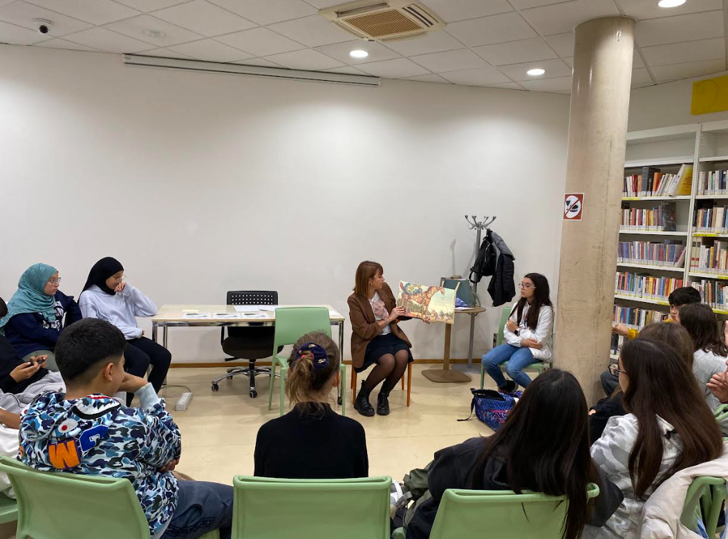 a group of people sitting in chairs in a room