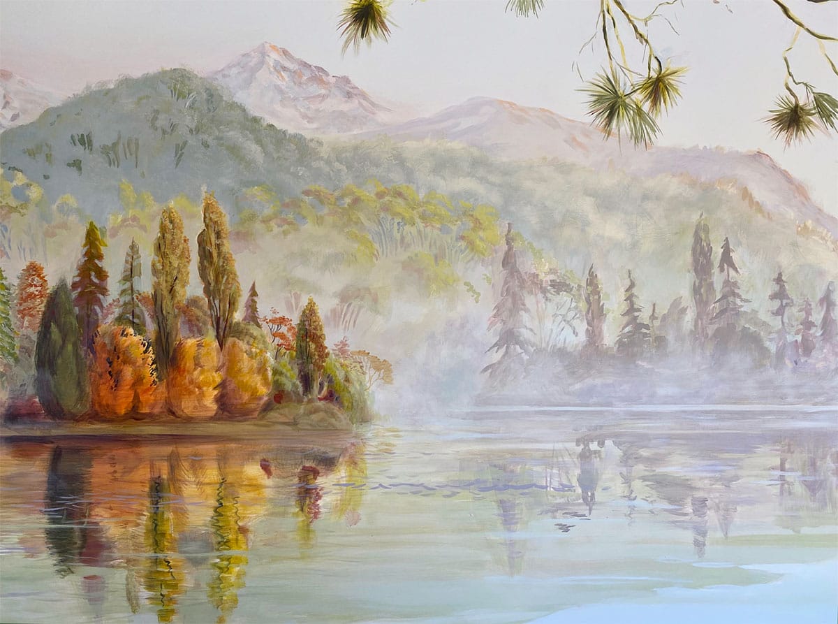 New Zealand-themed mural close-up, capturing a foggy lake, islands, trees, and mountain scenery.