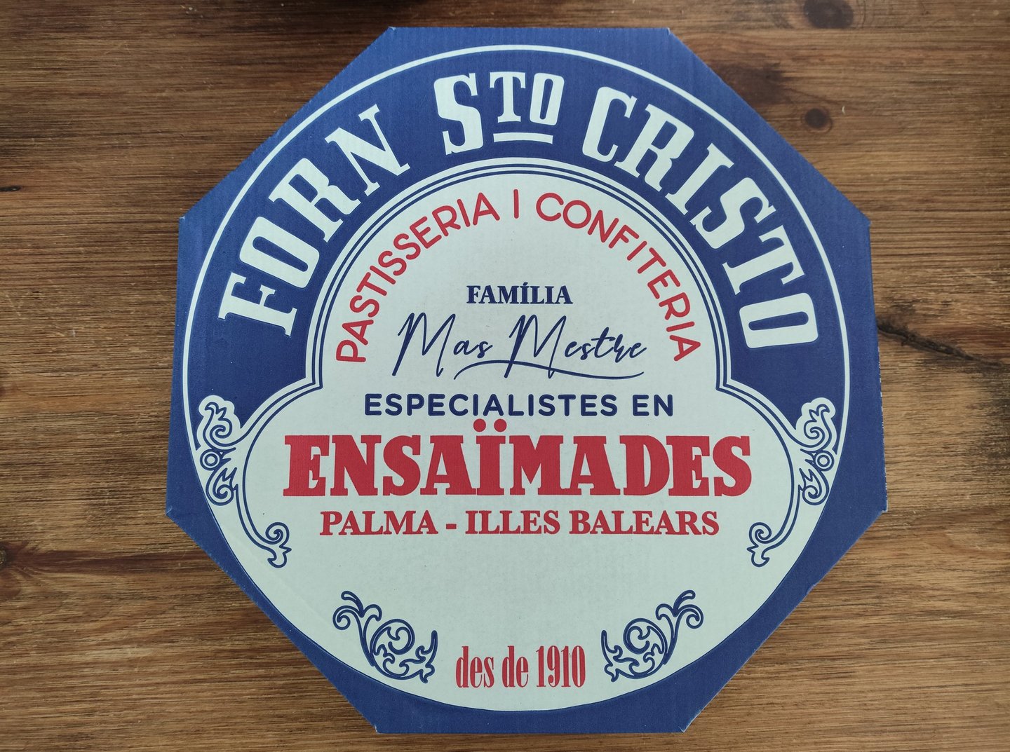 blue and white box filled with ensaimada Mallorca