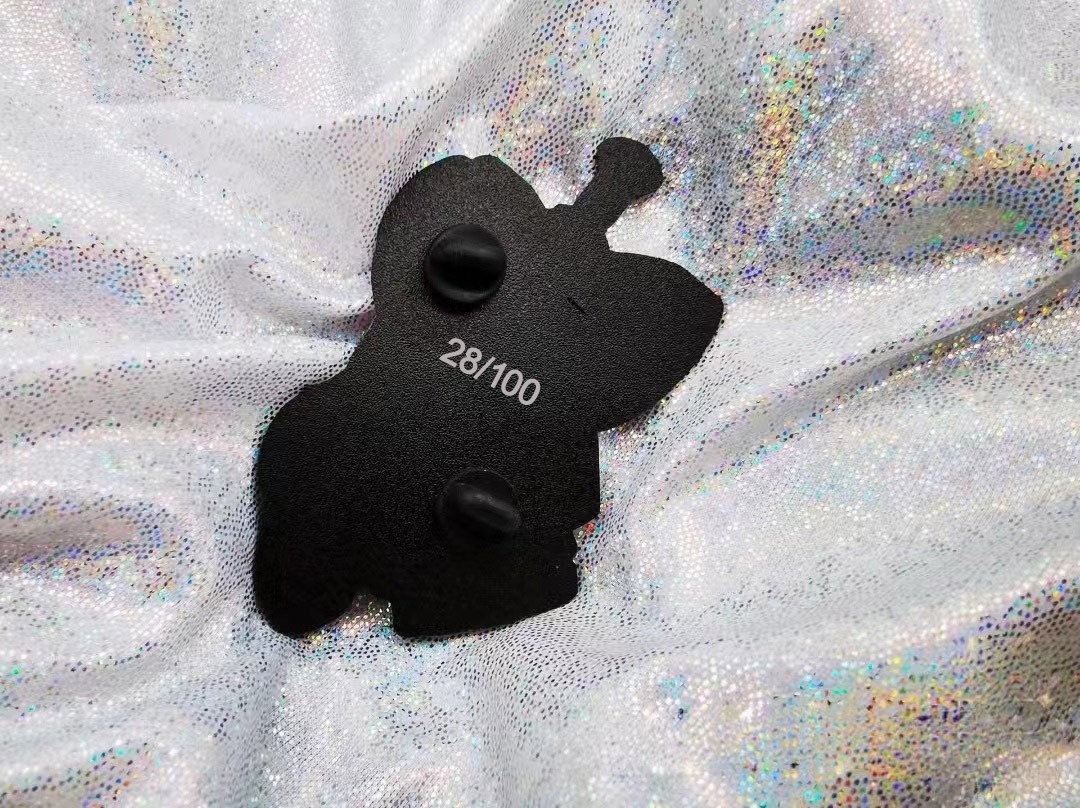 Black nickle plated enamel pin with lasered edition numbers