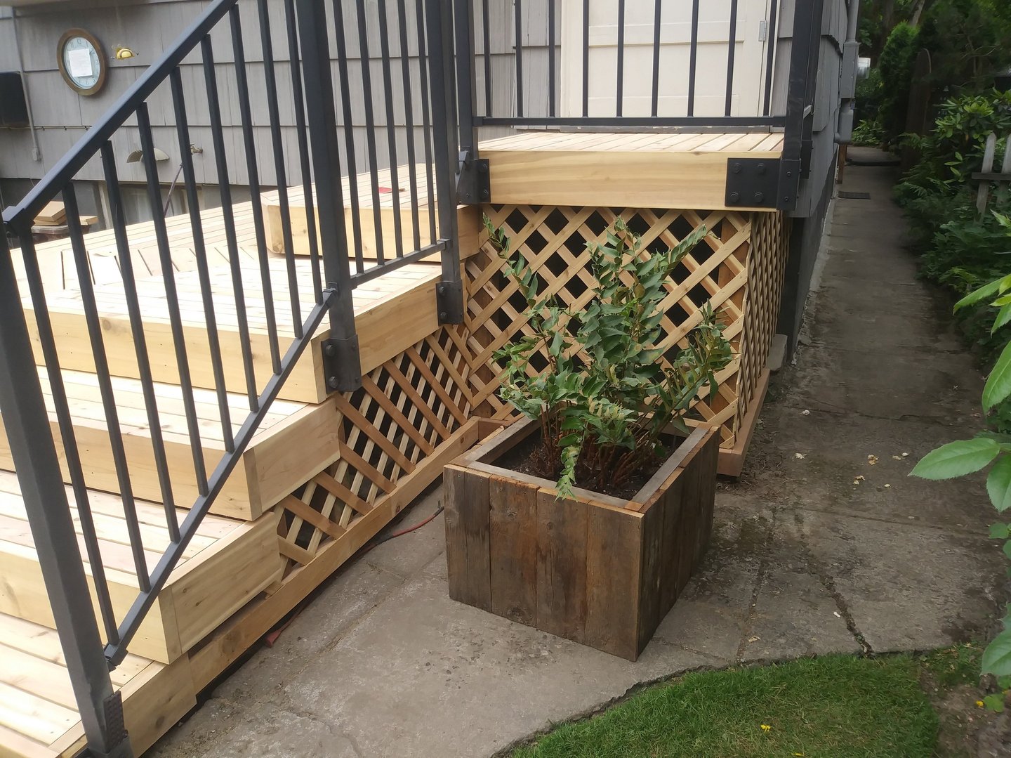 Cedar deck with a metal Handrail from Fortress Rails