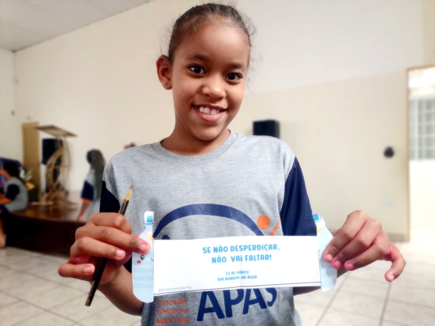 a young girl holding a sign that says, it's not a sign