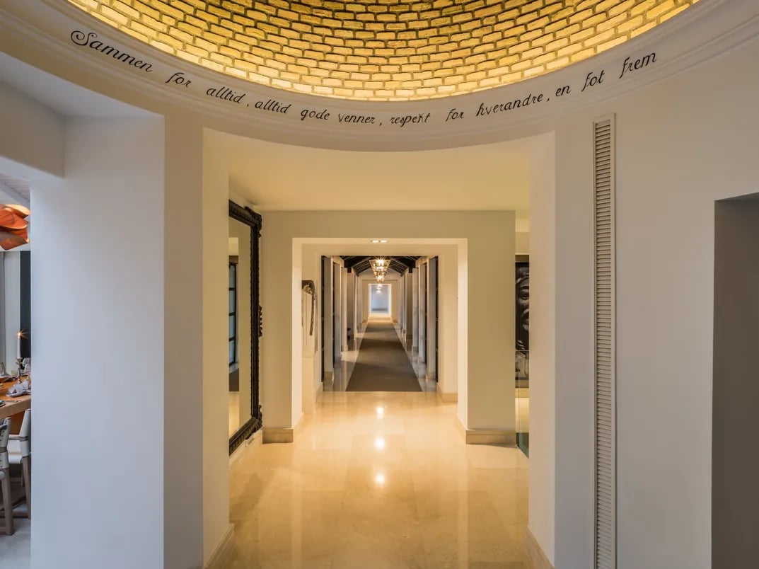 Golden-domed hallway with marble floors and symmetrical arches at Villa El Olivo, Marbella