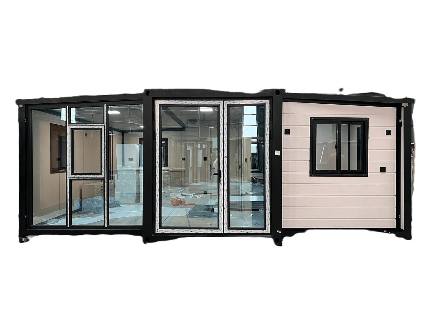 Modern expandable container house with glass doors and black window frames on a dark background.