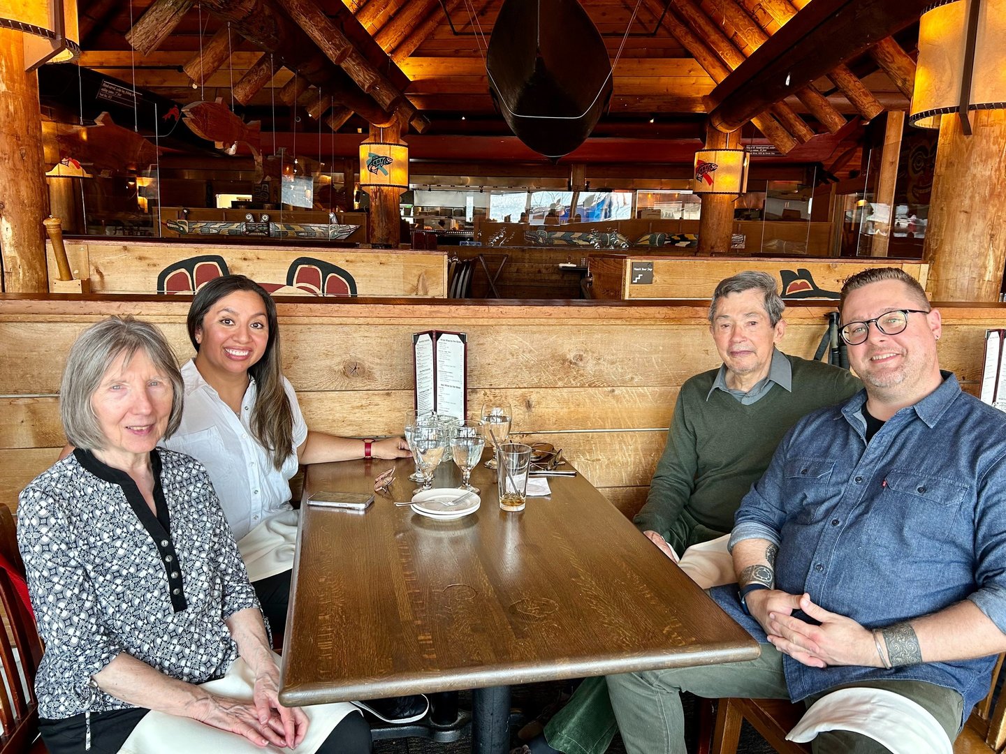 a group of people sitting at a table