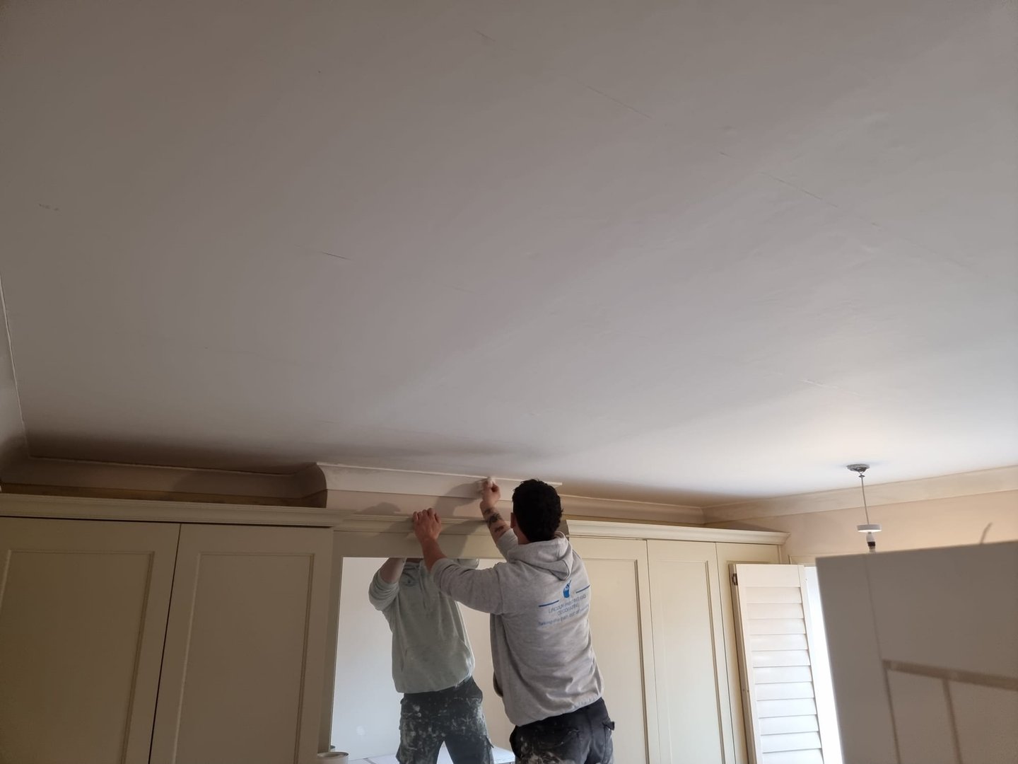 Our staff decorating an interior room in a residential home.