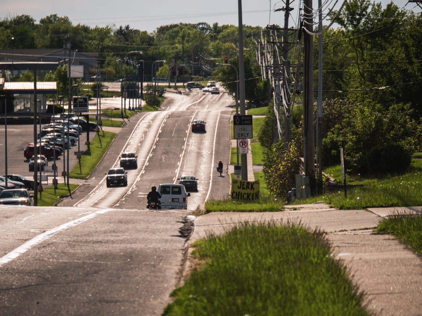 Cars on a busy road, and you can see fumes on the street
