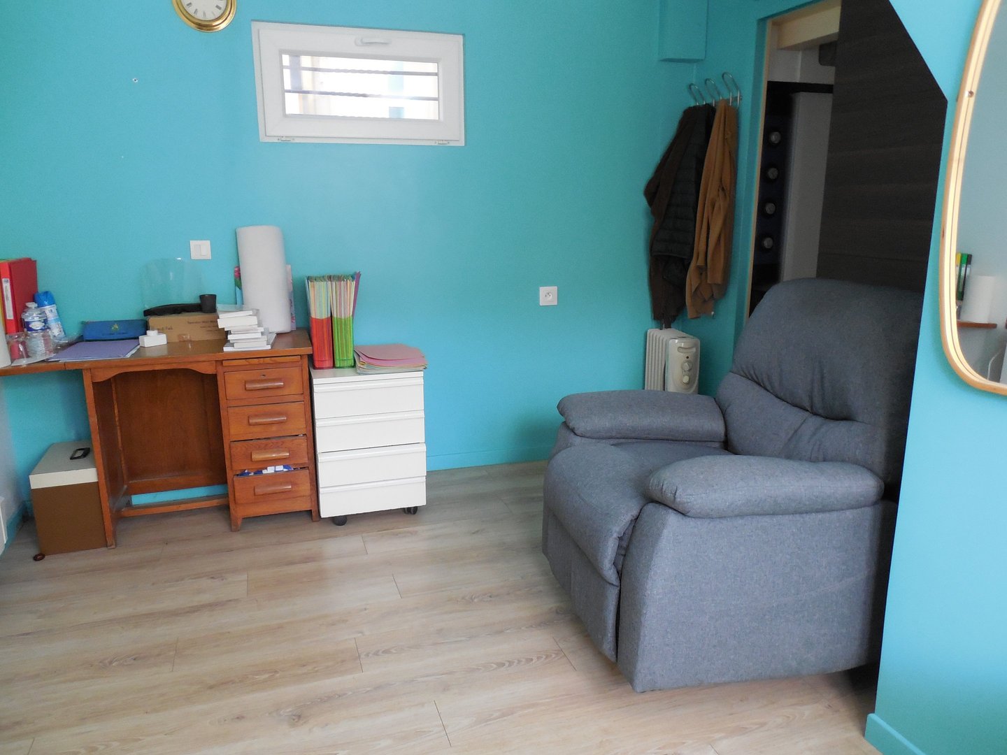 a chair with a chair and a desk with a mirror