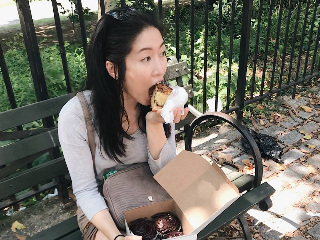 little twist bakery founder eating on a bench in NYC