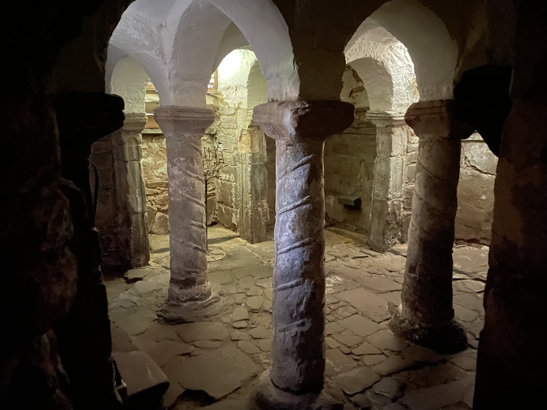 The crypt at Repton Church. A square room is broken up by four helical columns.