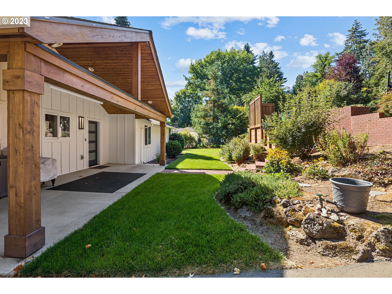 front porch with a closed cedar soffit and wrapped post