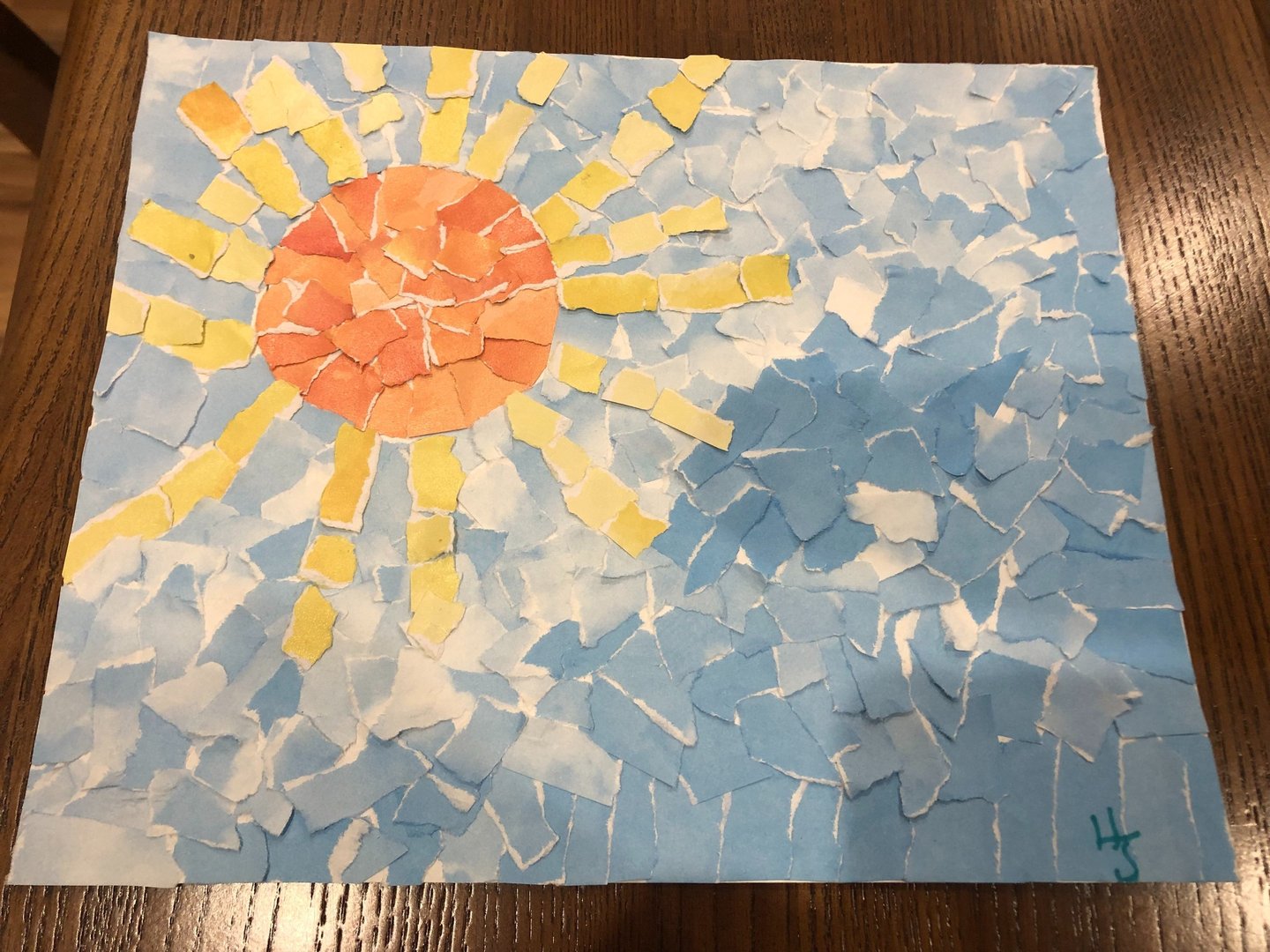 Collage made from torn paper by Heather Suto titled "Sun and Sea". 