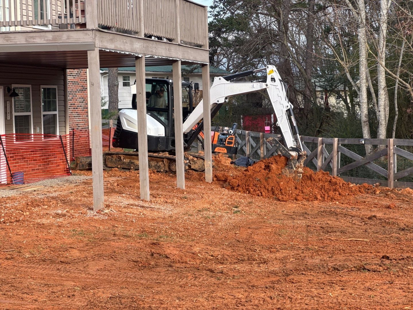 bobcat E60 excavator digging dirt for septic system in east tn