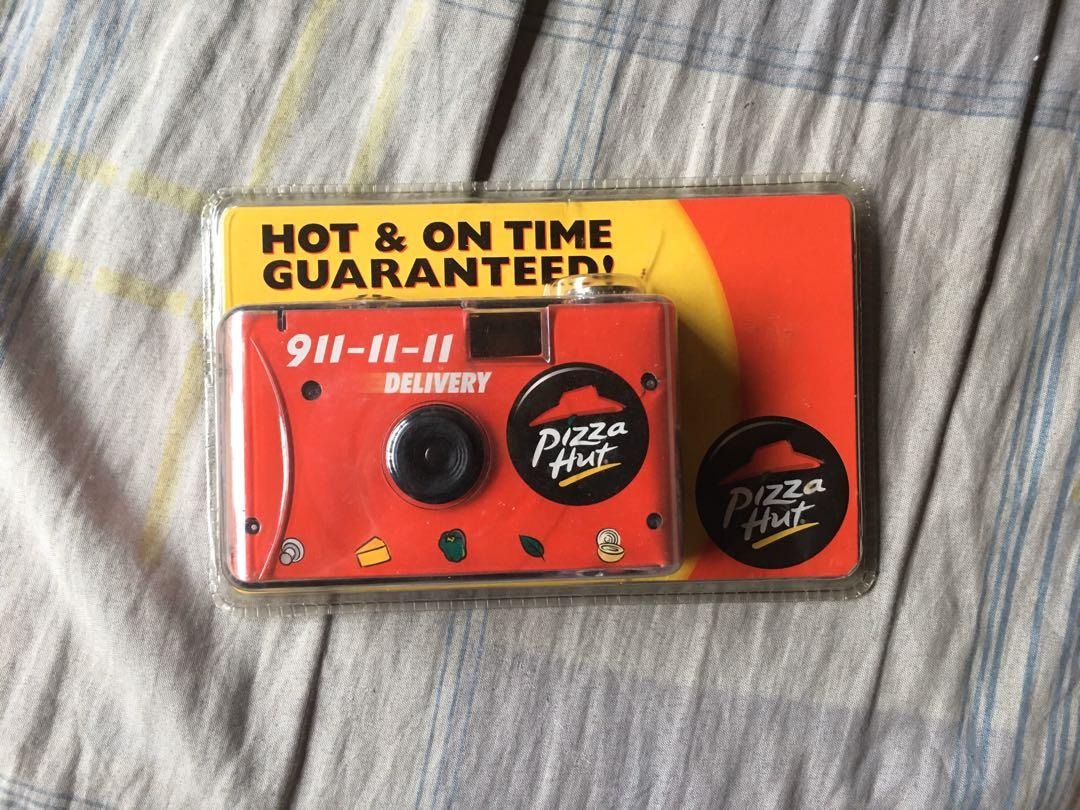 A packaged disposable film camera, in Pizza Hut's iconic colors and logo.