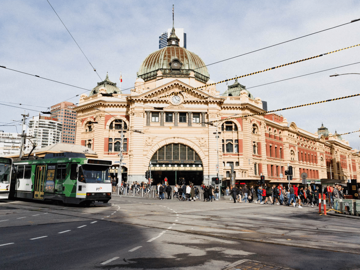 a bus is parked in front of a large building