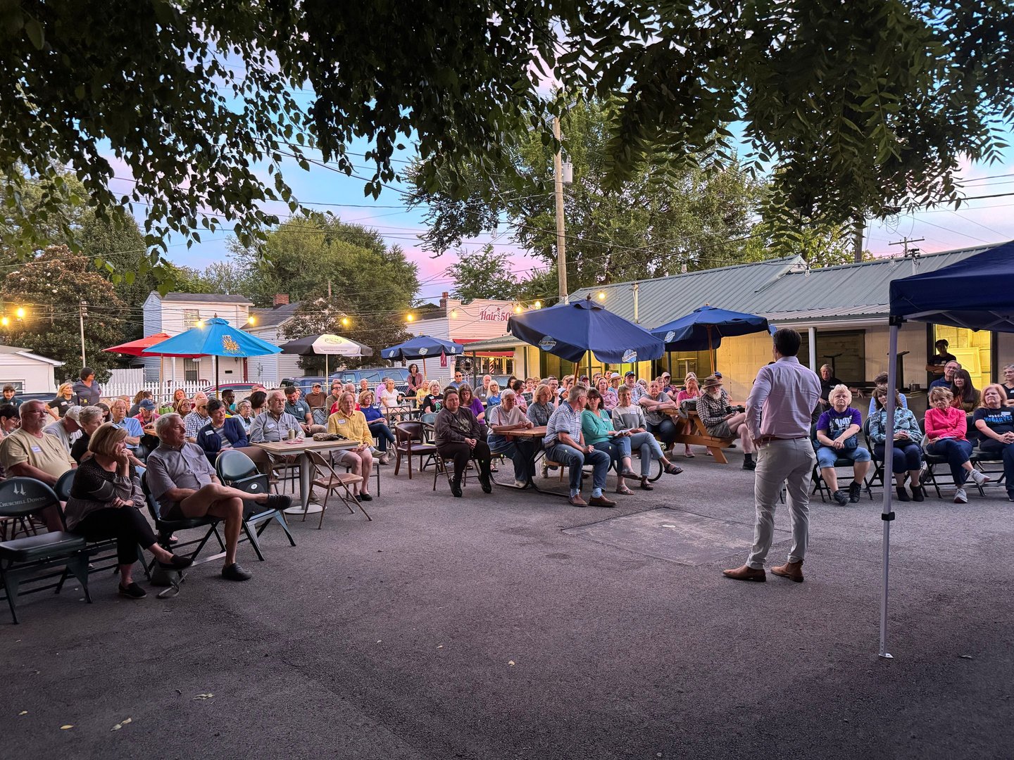 a man standing in front of a crowd of people