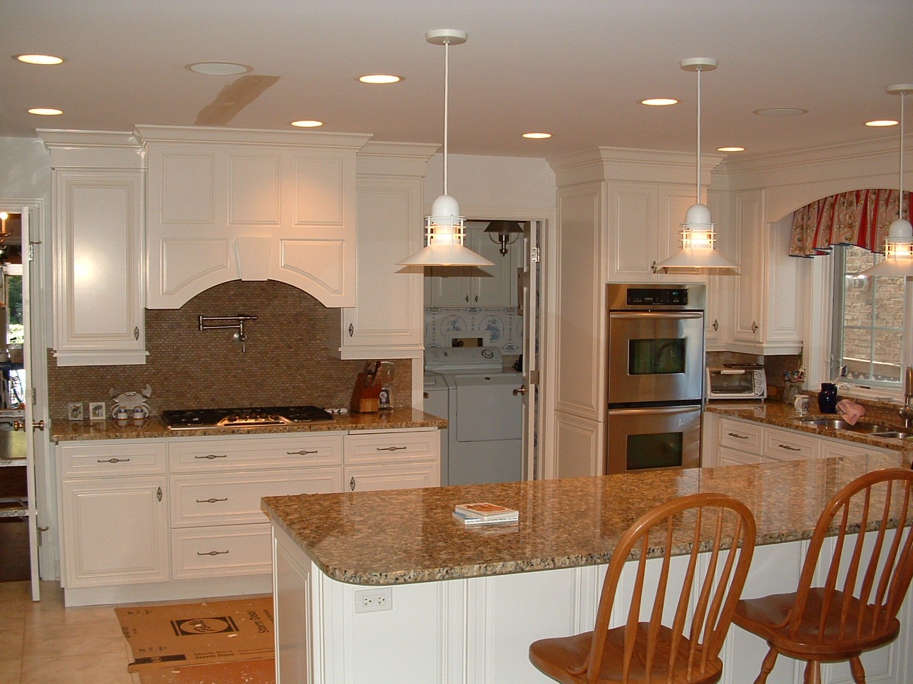Open kitchen remodel with island and updated cabinets