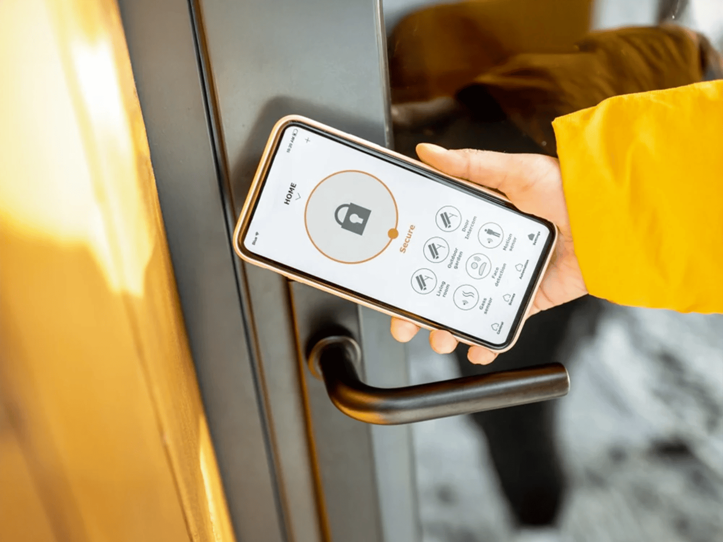 Smartphone unlocking digital door lock. Smart tech upgrades for Cedar Rapids business owners.