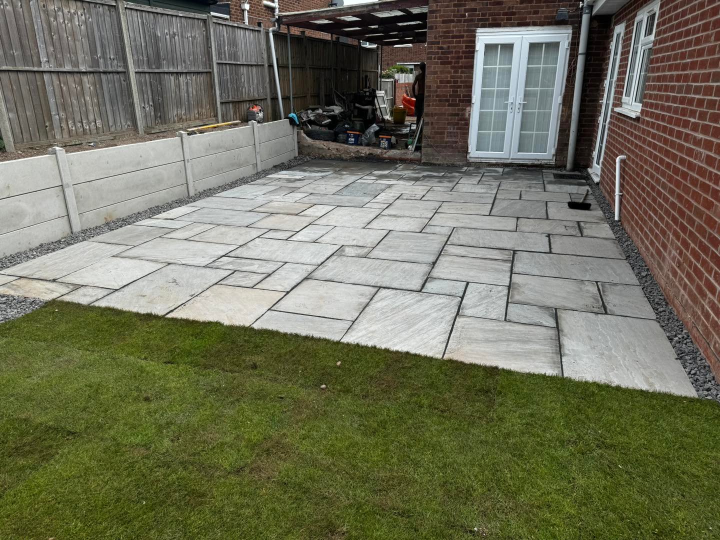 Neat and level slabbing work in Worcester garden by B R Building and Landscapes        Ask ChatGPT