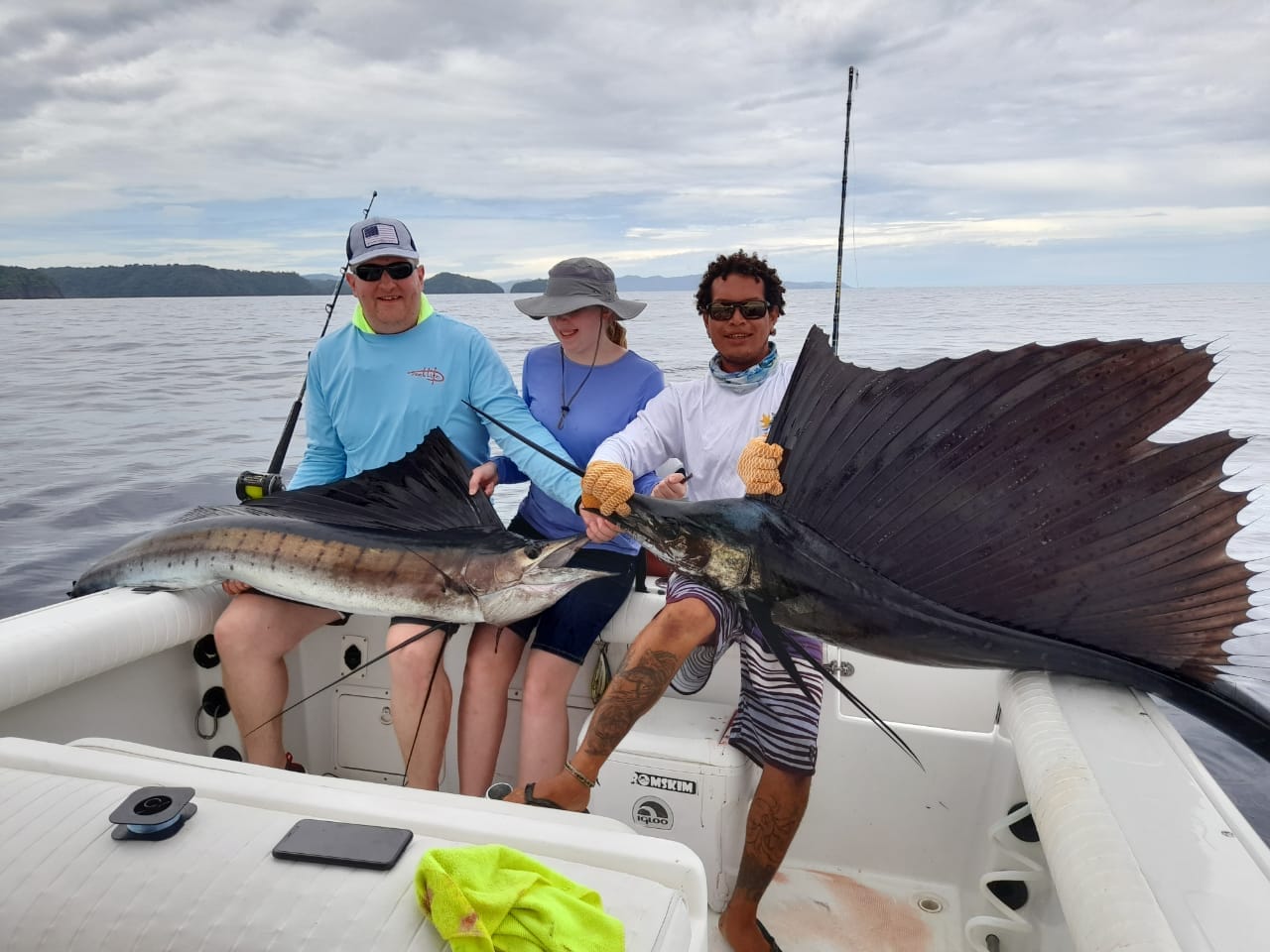 Happy guests with marlin catch during sport fishing charter in Papagayo, Costa Rica