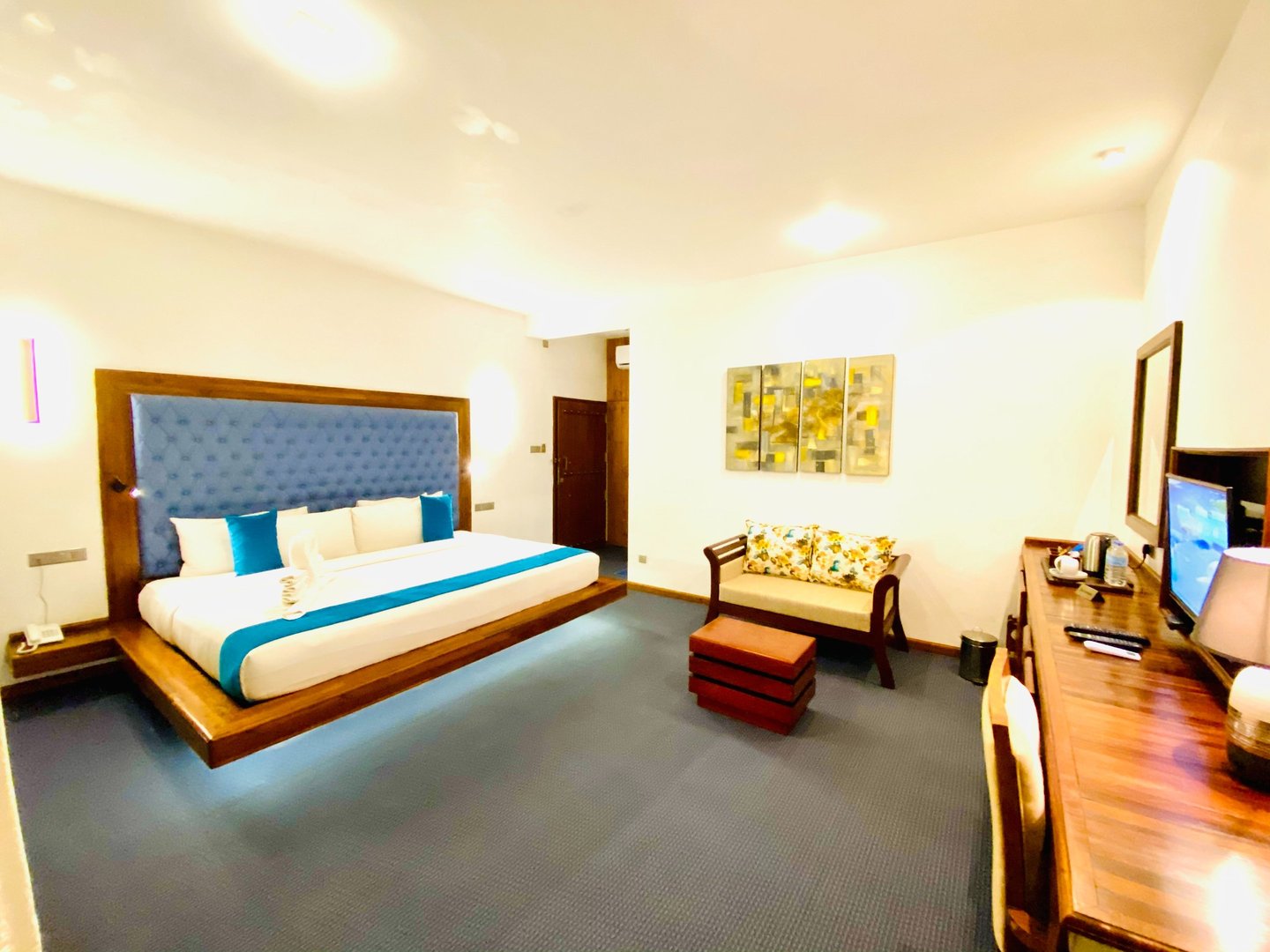 a bedroom with a bed and a desk