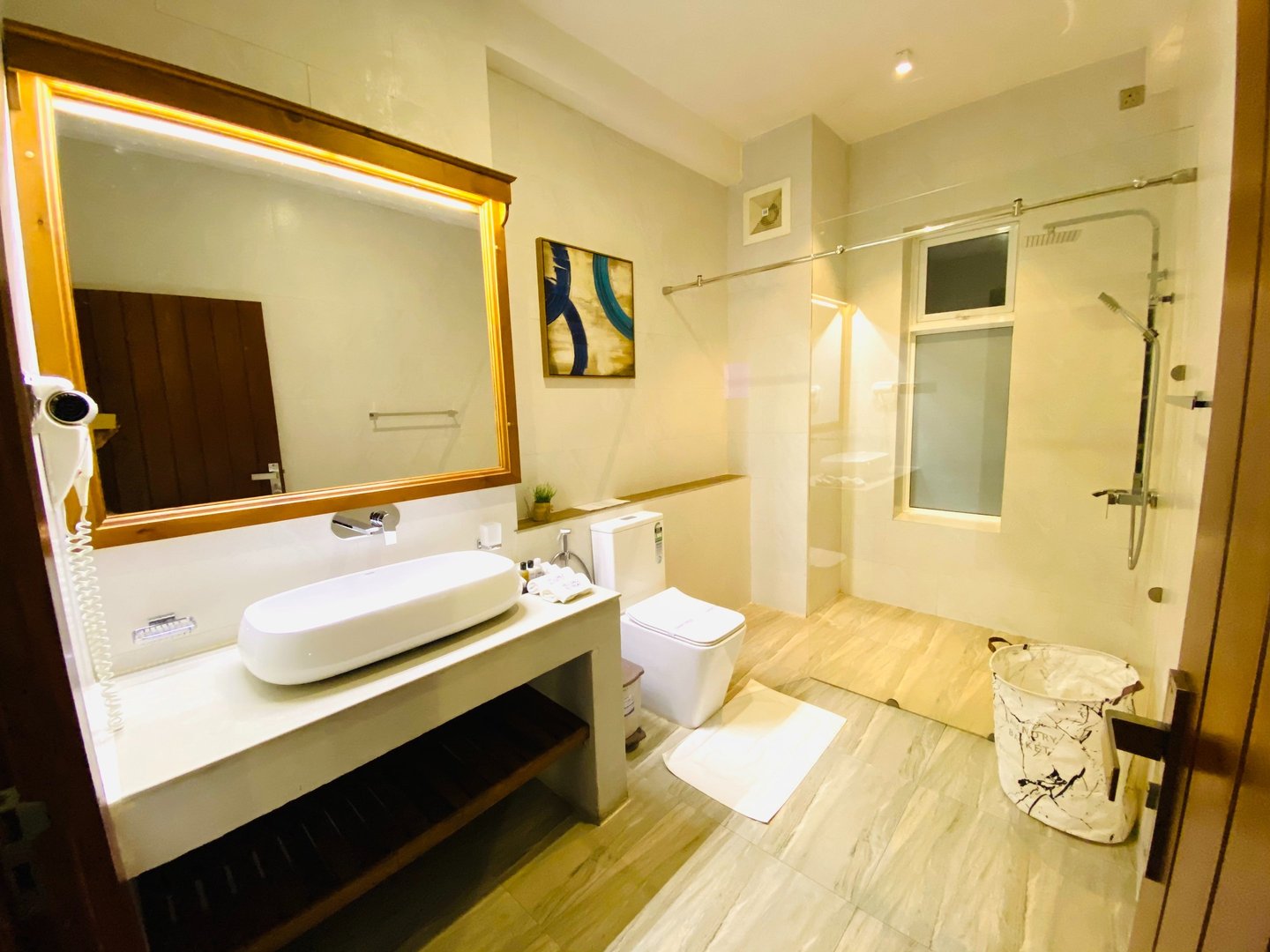 a bathroom with a large mirror and a sink