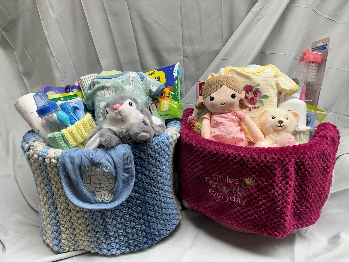 A pair of New Baby Welcome Baskets. Welcome Baskets contain everything baby needs for the first week