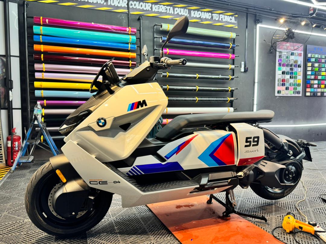 BMW CE 04 electric scooter wrapped in white and orange vinyl finish
