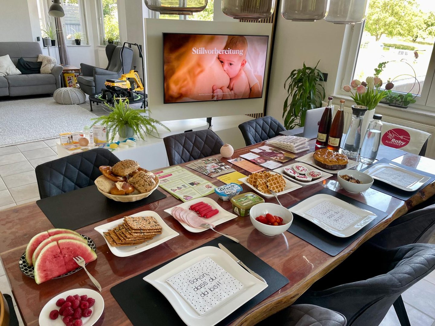 a table with plates of food and drinks