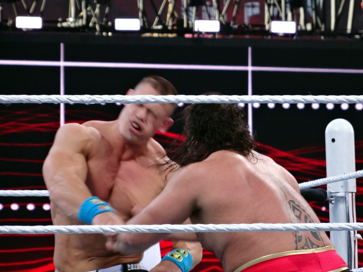 two wrestlers fighting in ring