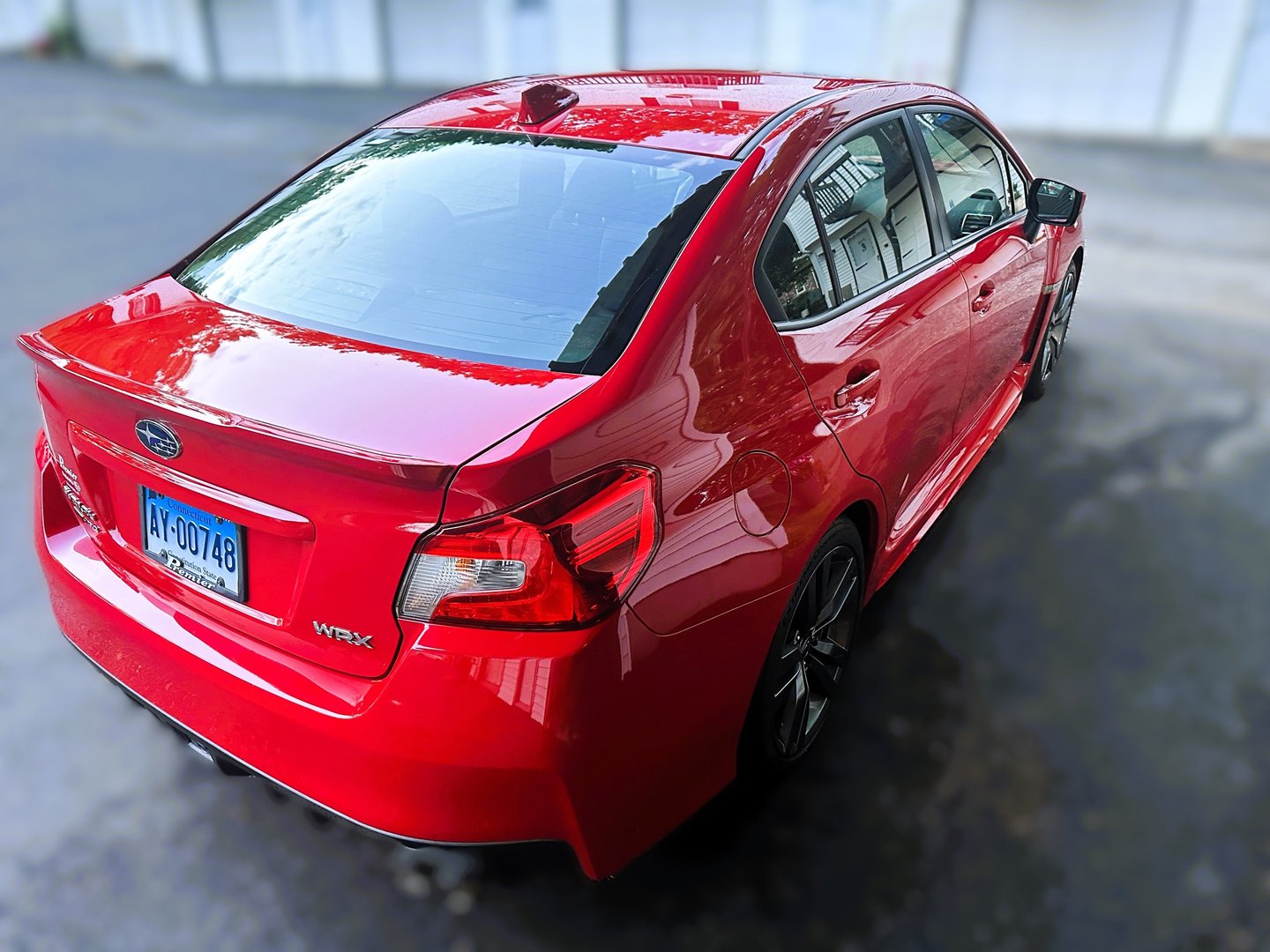 paint correction and ceramic coating of red subaru sports car