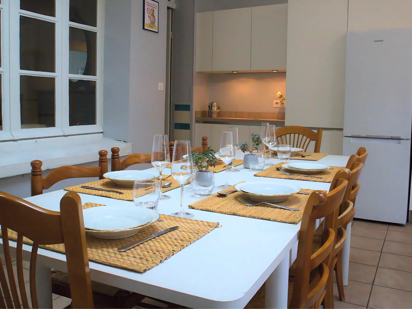 Dining room with equipped table for team meals in professional accommodation