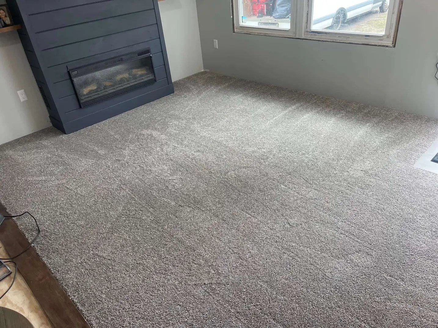 Cozy bedroom with soft grey plush carpet installed by Master Carpet, enhancing comfort and style in London, Ontario homes