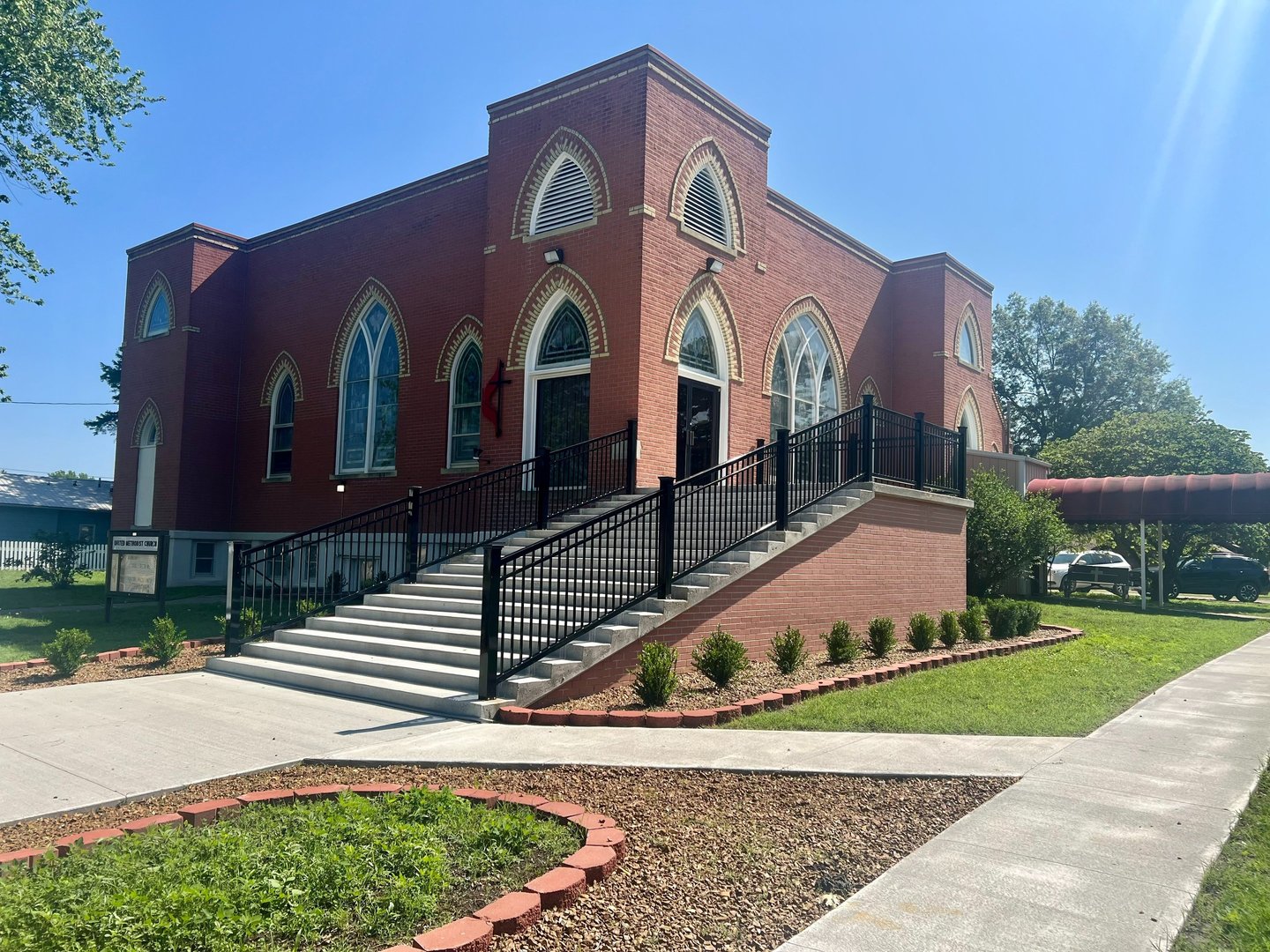 Moran United Methodist Church building new stairs, landscaping, and new sidewalk. May2023