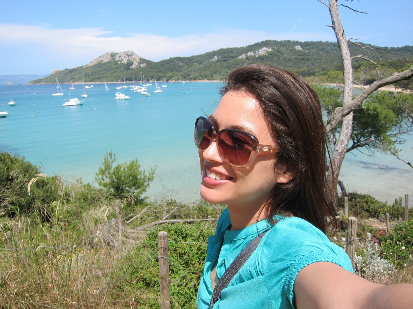 a woman taking a selfie with her cell phone