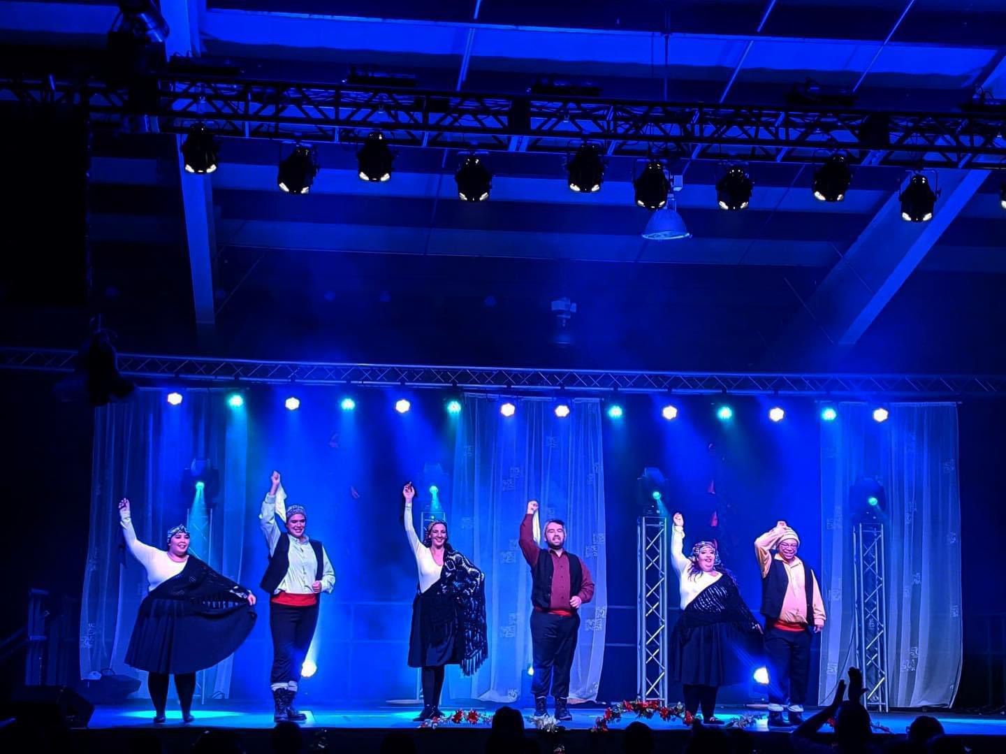 a group of people standing on a stage