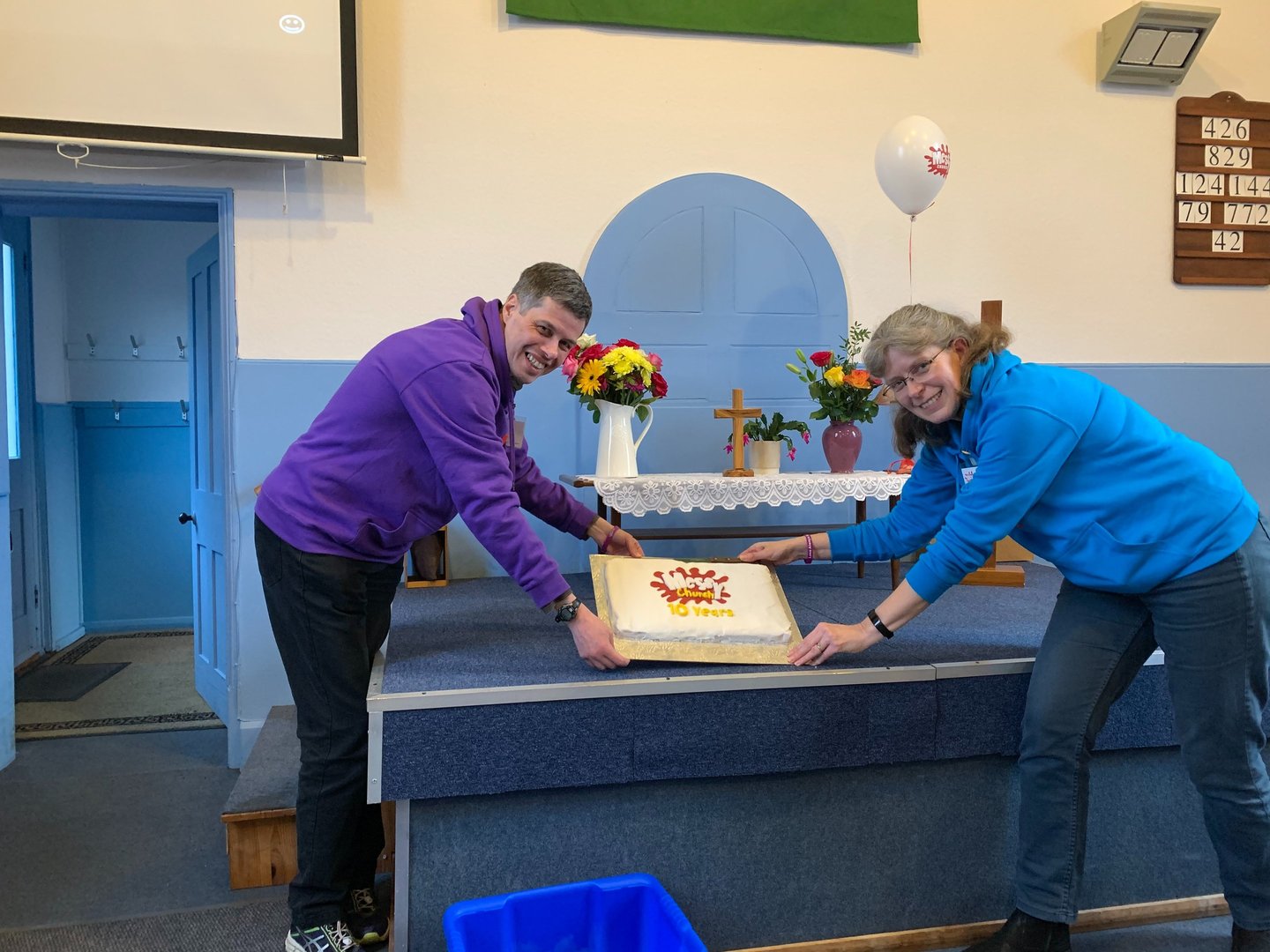 People with a celebration cake