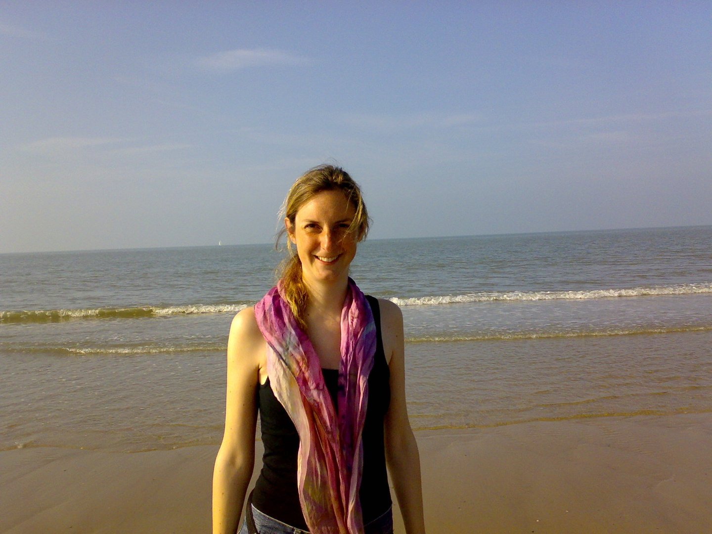 Friendly smiling woman at the beach