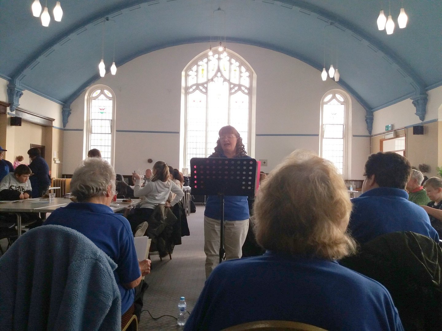Janice leads choir at the Target Café