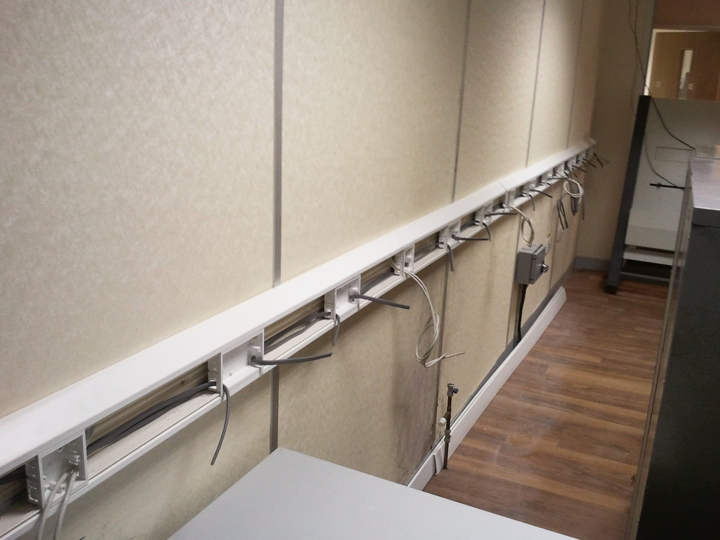 Commercial dado trunking and electrical wiring installation in a Dartford business unit