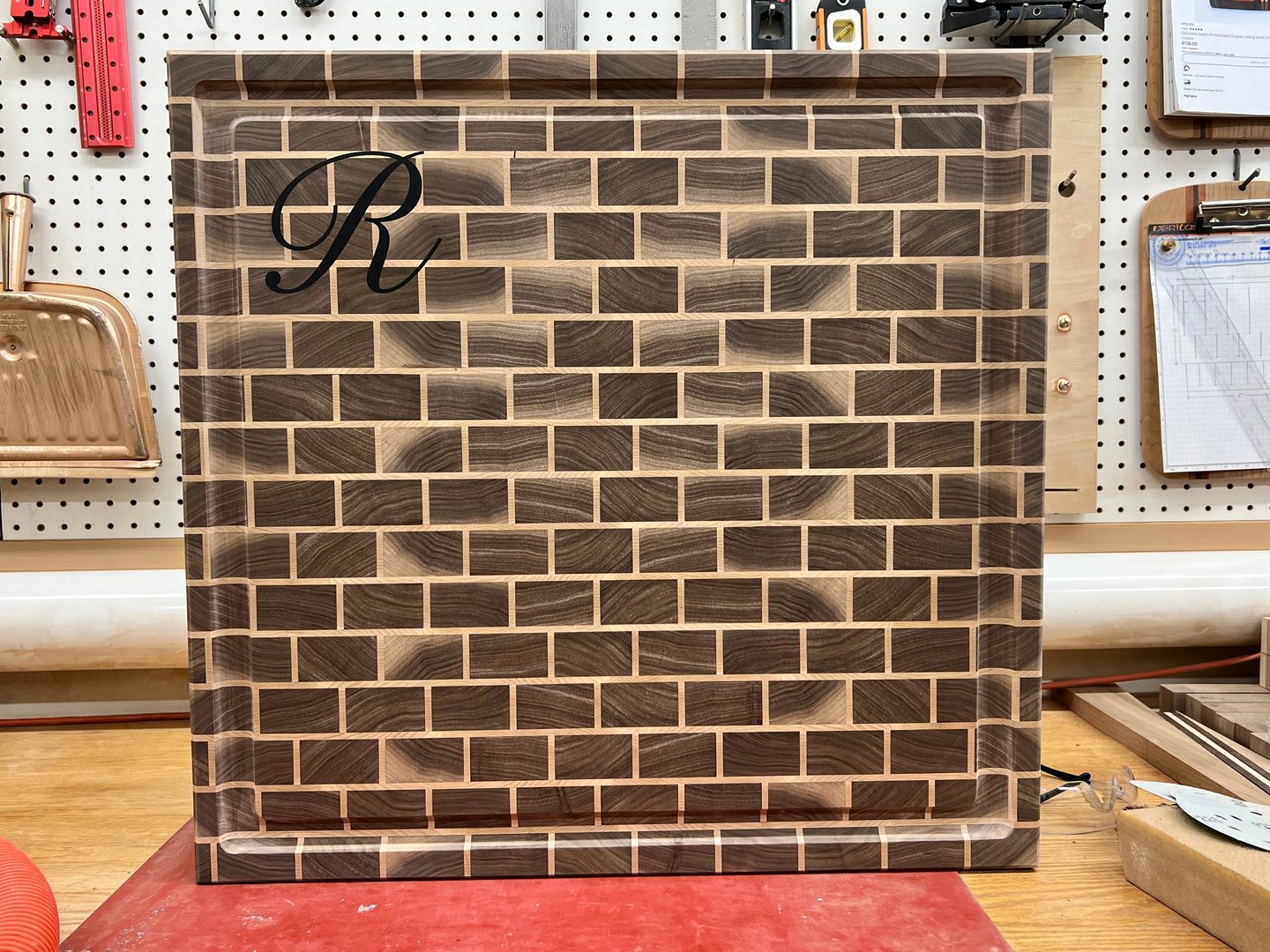 24" x 24" Brick Style. Black Walnut with Hard Maple grout. Personalized with Black Graphite epoxy.