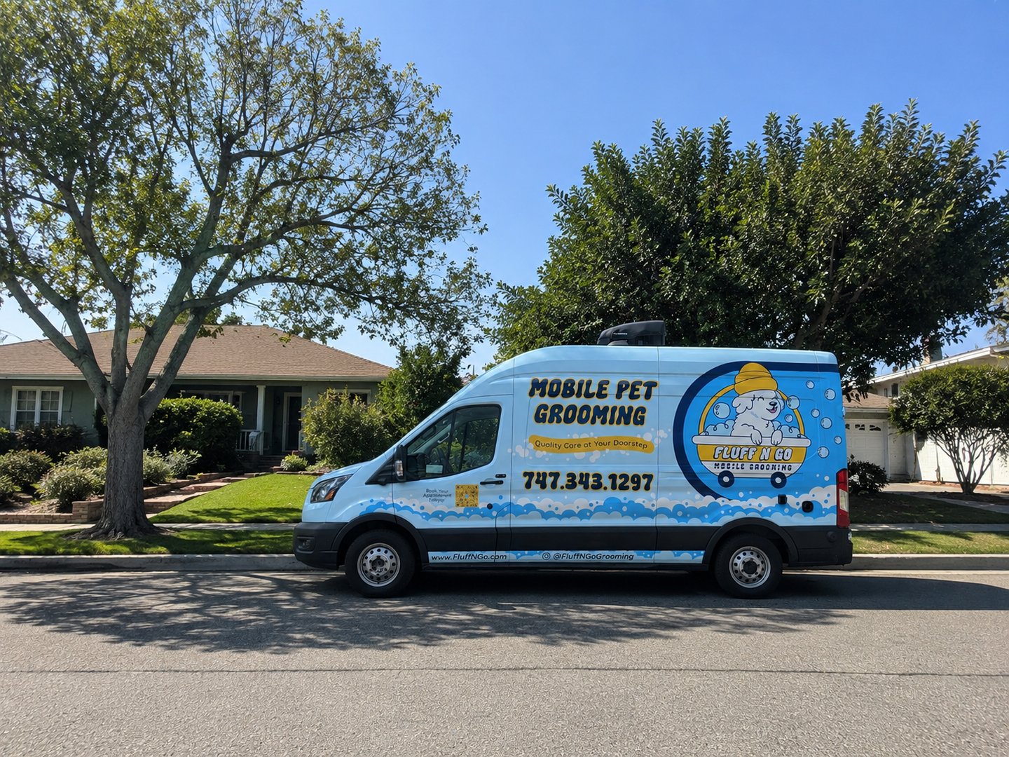 Fluff N Go mobile dog grooming van parked in a Los Angeles suburb neighborhood