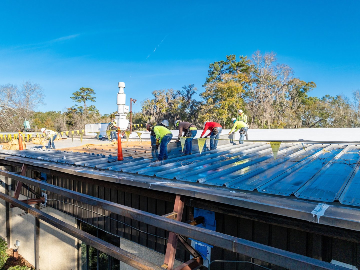 Workers replacing a roof