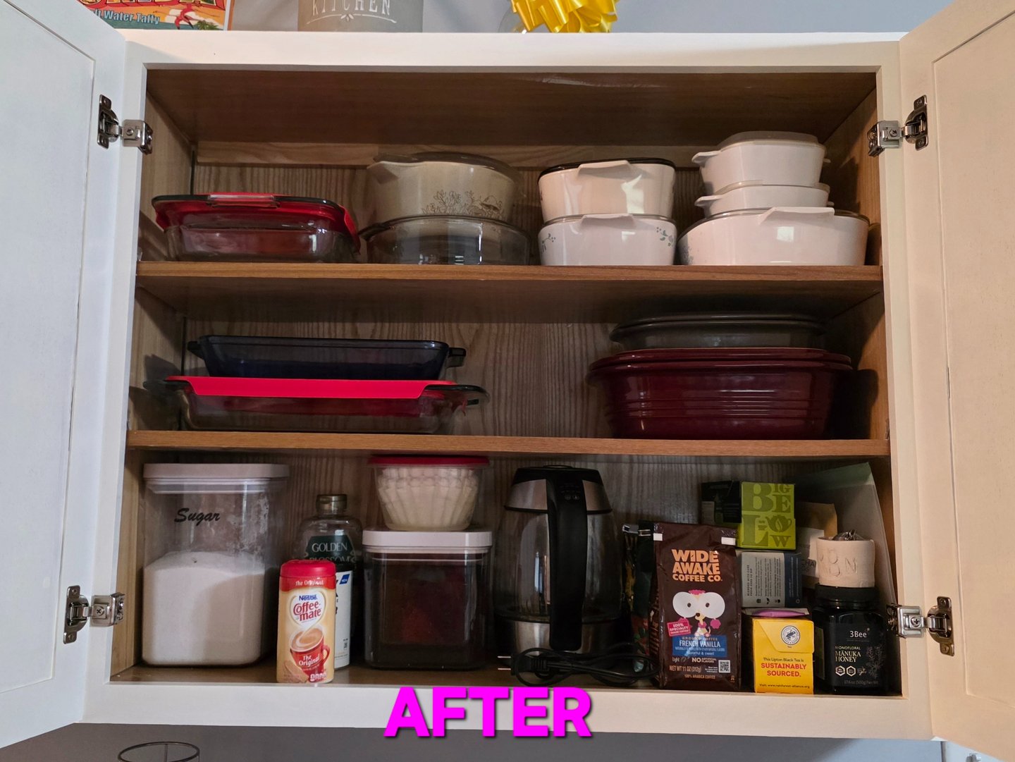 After: Kitchen cabinet organized with categorized items and easy access