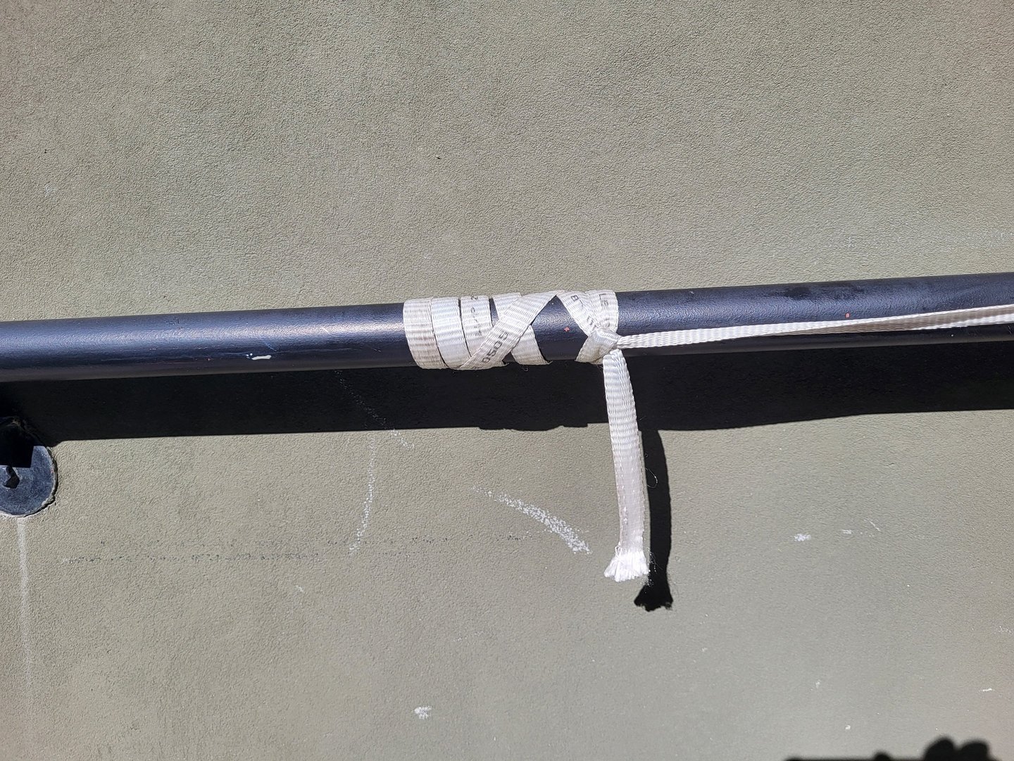 Icicle Hitch tied in Mule Tape, powerfully gripping a railing.