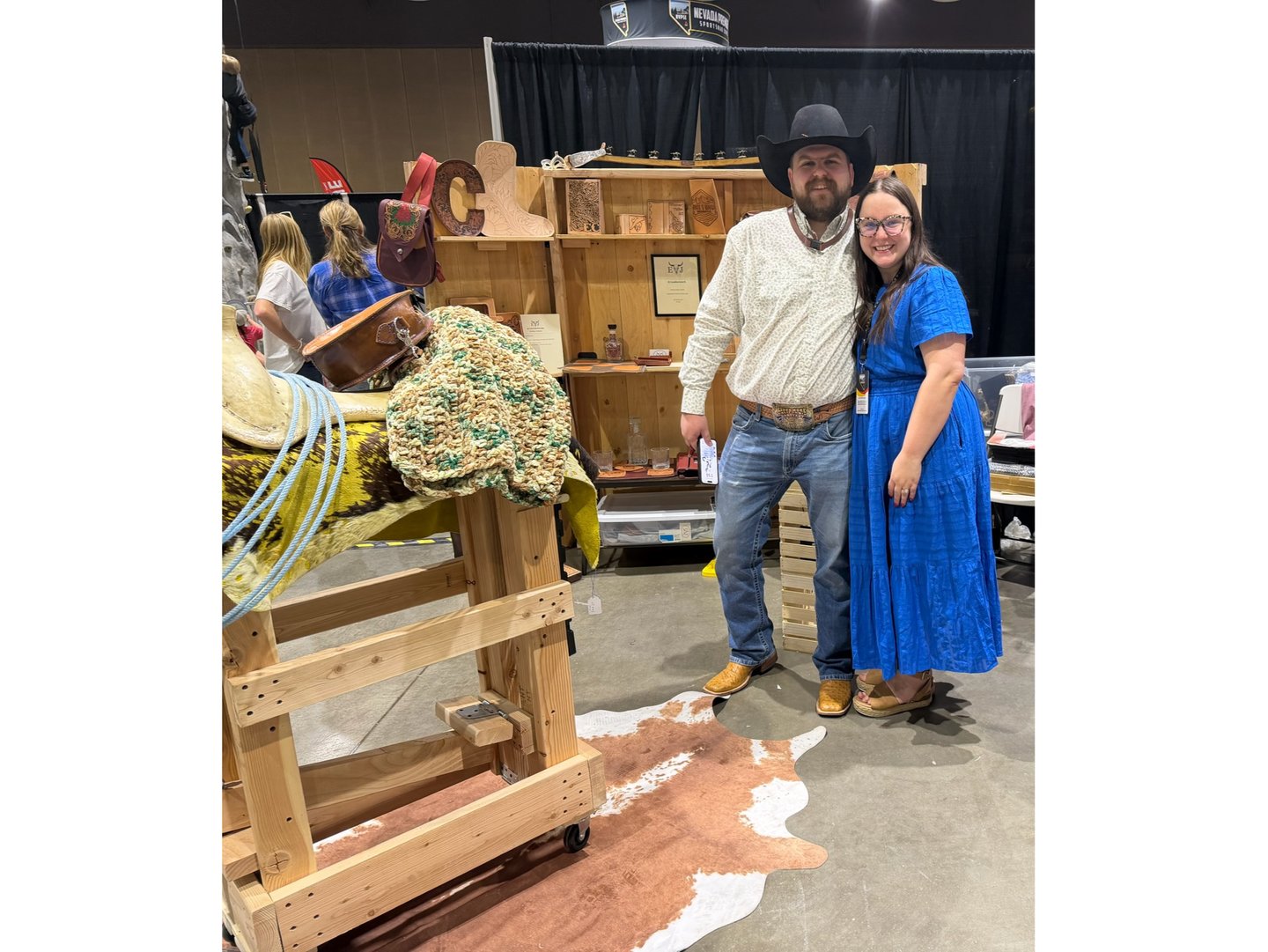 EJ Leather, LLC craftsman at booth showcasing handmade leather goods