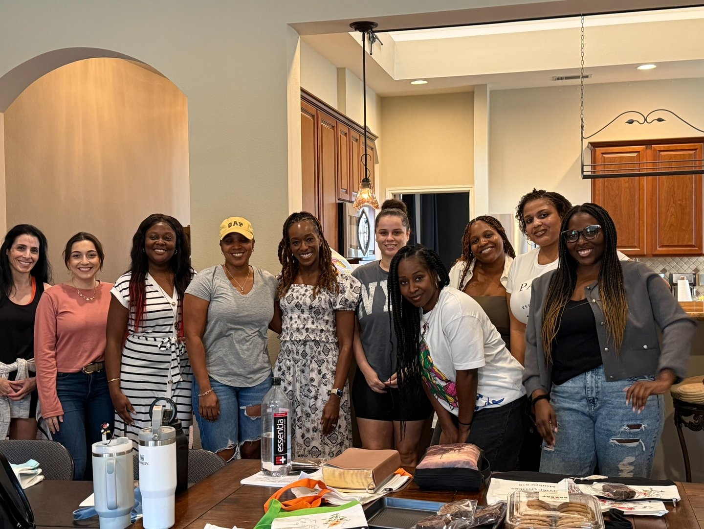 Women gathering in faith-based community Bible study in persons home